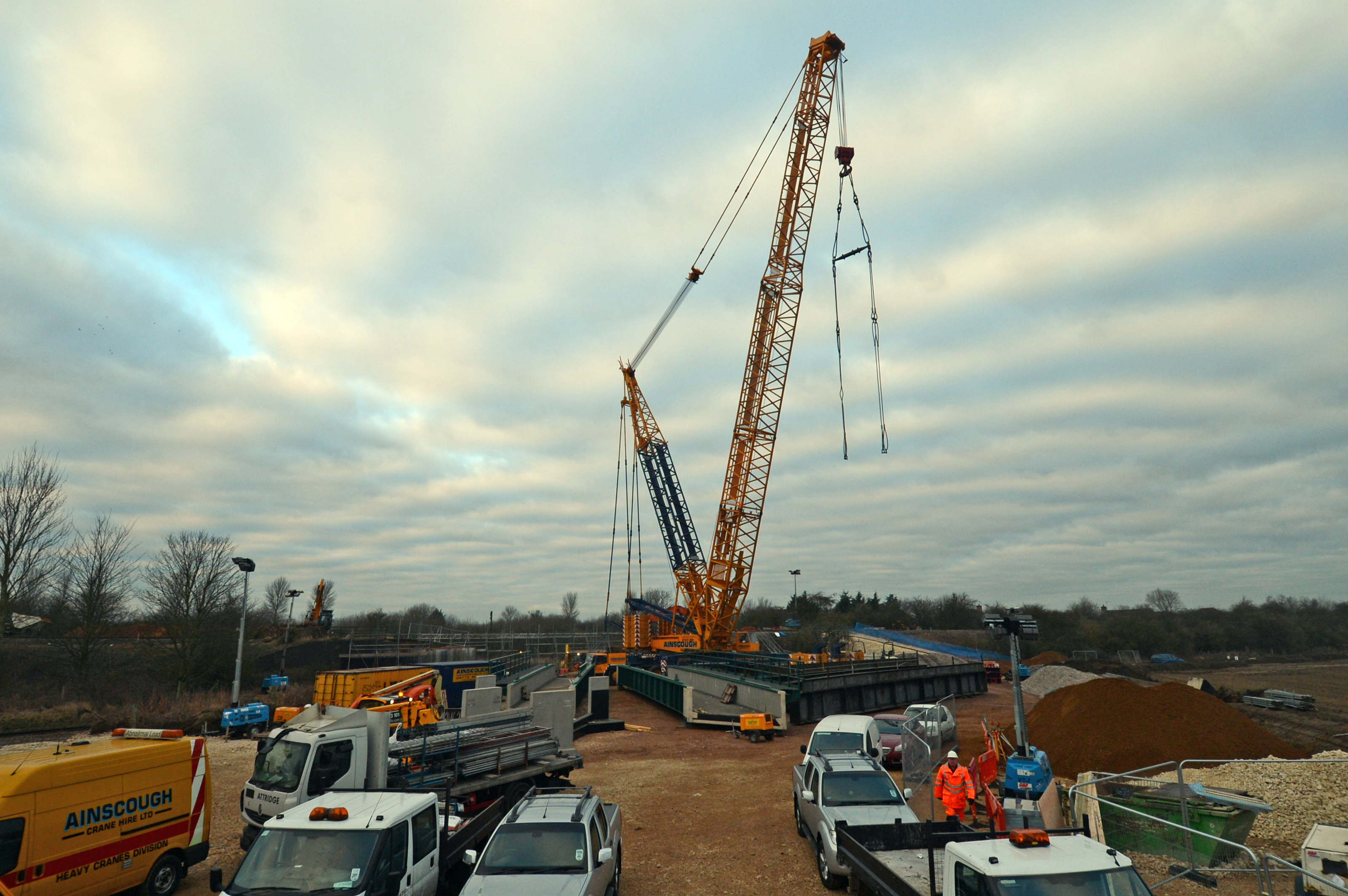 In March 2013 three different bridges on the Sleaford avoiding line were replaced during a 10 day blockade. Here, a 1000 tonne crane rests after lifting out the old rail bridge over the railway line to Skegness. In the foreground to the left of the old bridge you can see the two sections of the new bridge ready to go in.