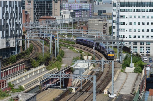 The approaches to Salford Central from the East,looking towards Manchester Victoria. Northern's 319386 approaches with a service to Liverpool Lime St running on the newly electrified route via the original Liverpool & Manchester railway.