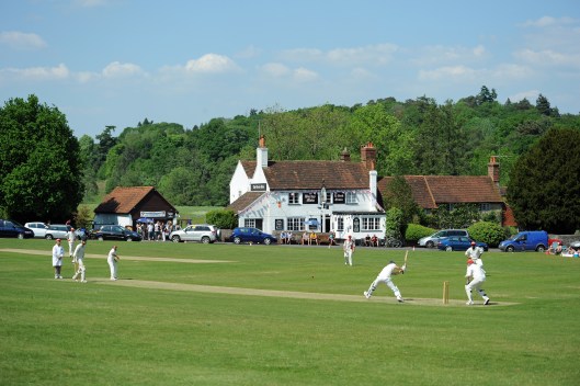 Quintessentially English, cricket on the village green outside the local pub