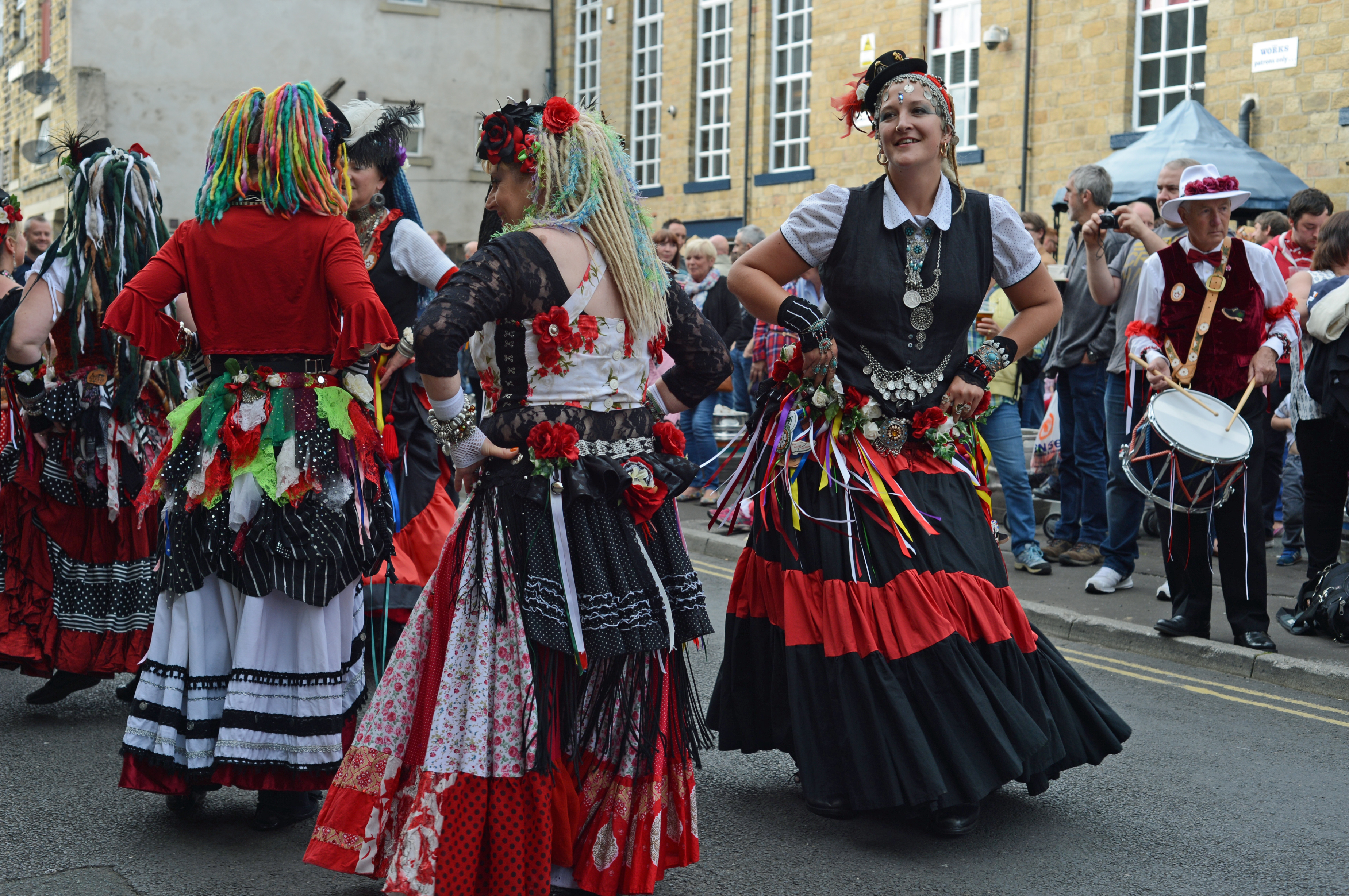 400 Roses are regulars at Rushbearing. They combine UK-style folk dancing with more exotic tribal belly dance moves. When designing their costumes they decided to use an abundance of red and white silk roses appropriate to their Yorkshire & Lancashire origins, hence their name.