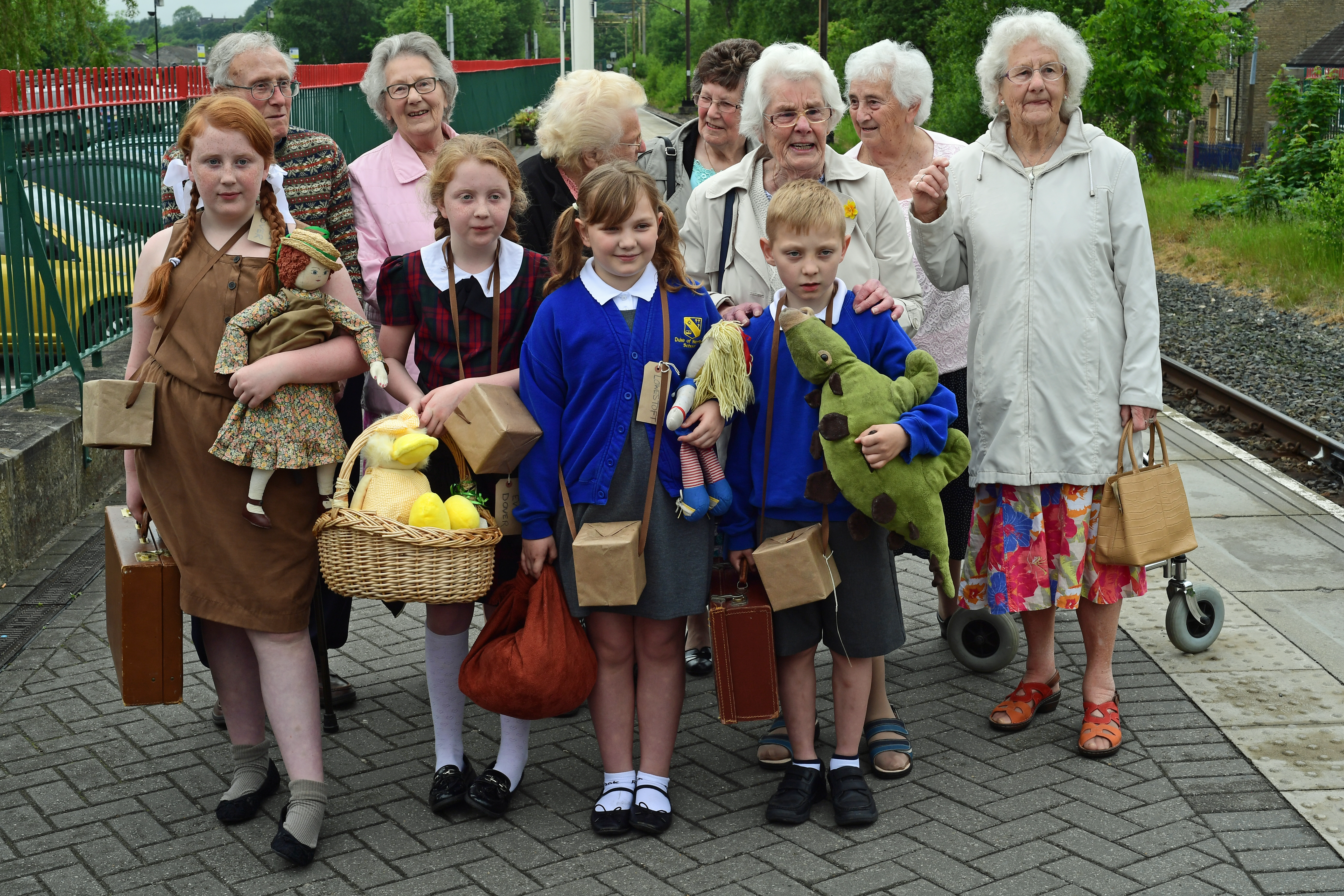 DG271453. Some of the original Lowestoft evacuees with local children. Glossop. 2.6.17.JPG